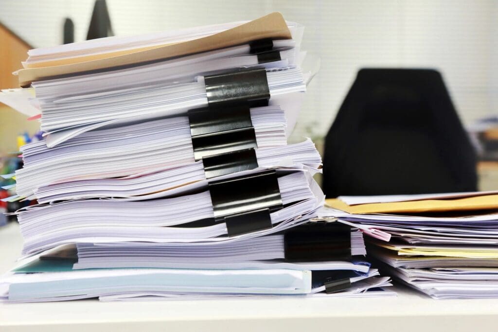 closeup of stack of documents on the table