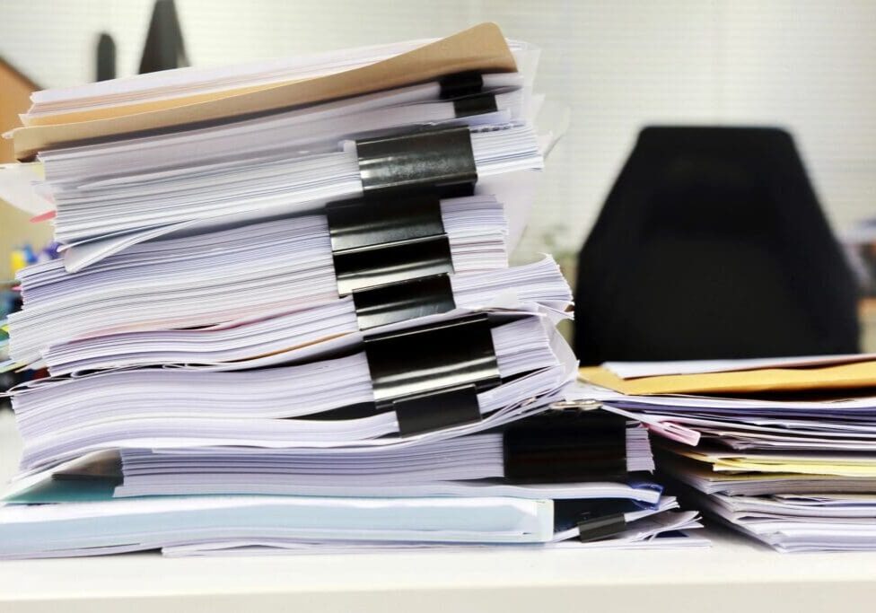 closeup of stack of documents on the table